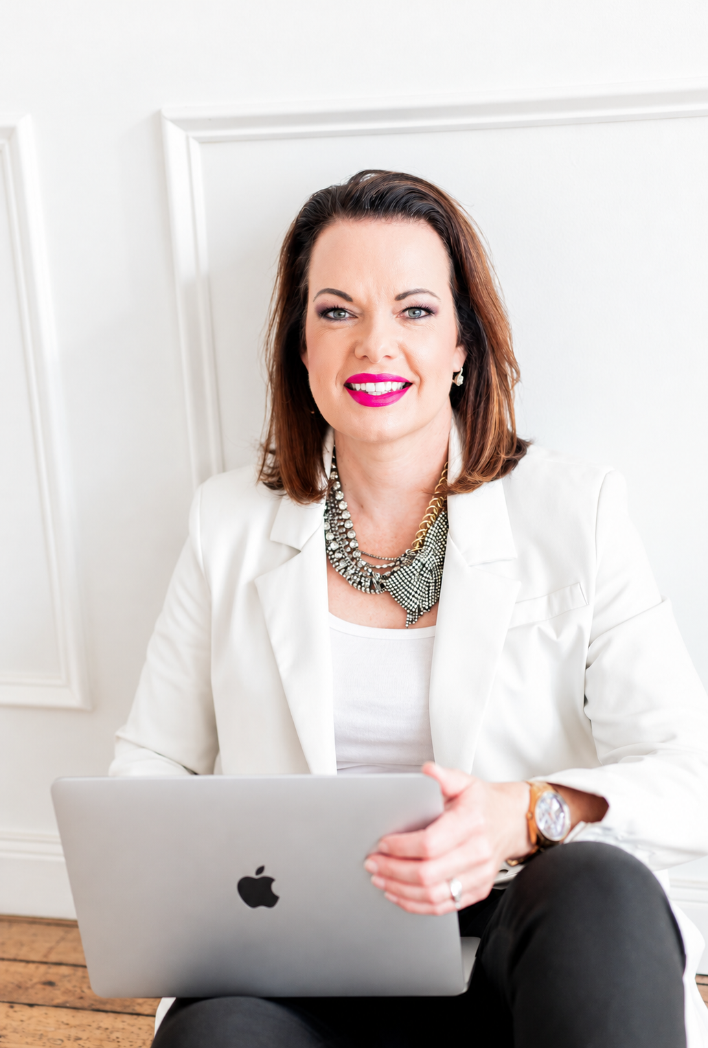 Marie Monville with a silver laptop